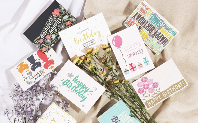 a Variety of Birthday Cards on Bed Sheet