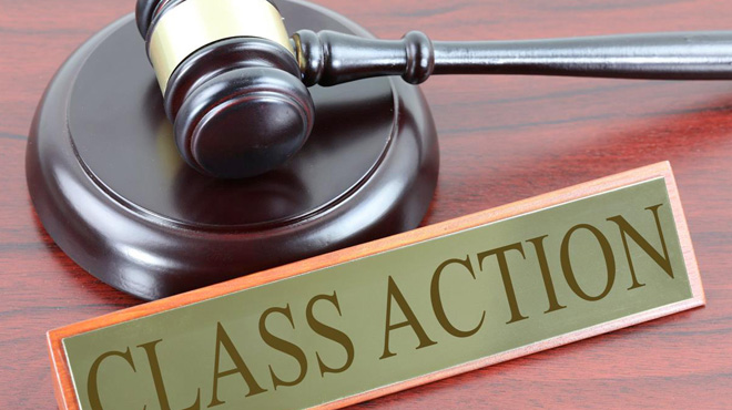 A Gavel and a Class Action Sign on a Table