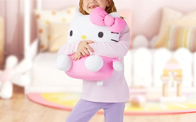A Girl Holding Hello Kitty Squishy Pillow
