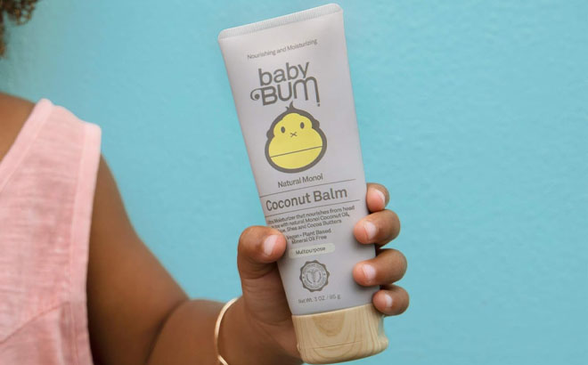 A Hand Holding Baby Bum Coconut Balm