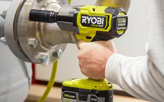 A Hand Holding Ryobi Brushless High Torque Impact Wrench