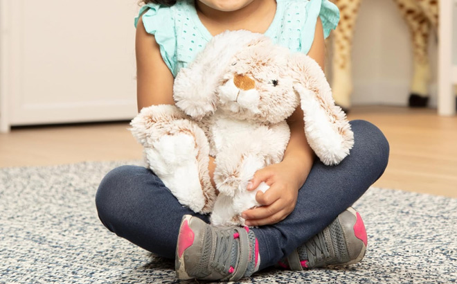 A Kid is Holding Melissa Doug Burrow Bunny Rabbit Stuffed Animal