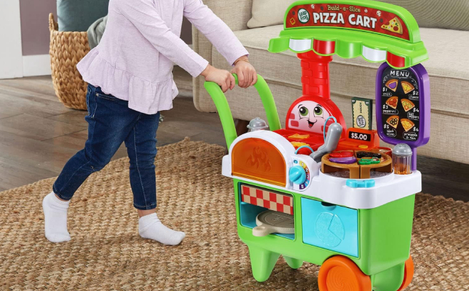 A Little Girl Pushing her LeapFrog Build a Slice Pizza Cart