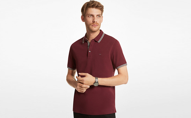 A Man Wearing Michael Kors Greenwich Cotton Polo Shirt