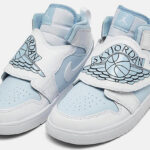 A Pair of Nike Air Jordan Sky Jordan I Kids Shoes