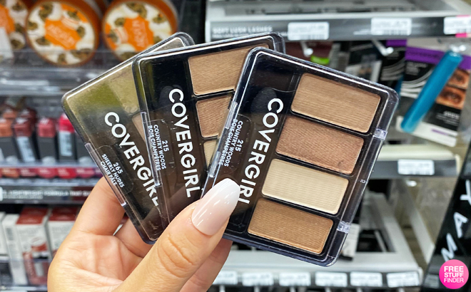 A Person Holding Covergirl Eyeshadow Palettes