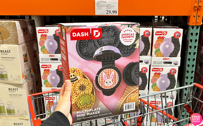 A Person Holding Dash Mini Waffle Maker with Removable Plates at Costco Store