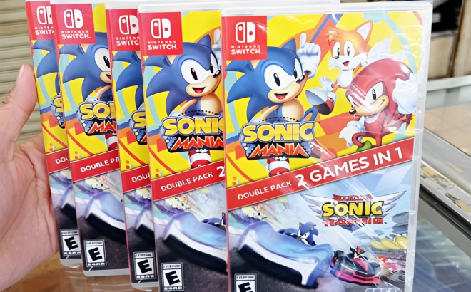 A Person Holding Nintendo Switch Sonic Mania Team Sonic Racing Double Pack Game
