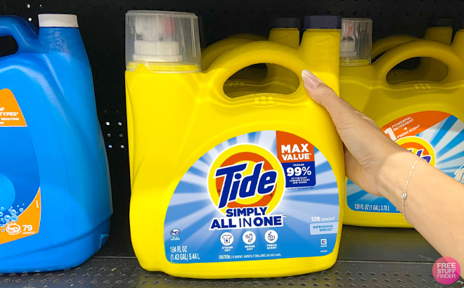 A Person Holding Tide Simply Liquid Laundry Detergent on a Shelf at a Store