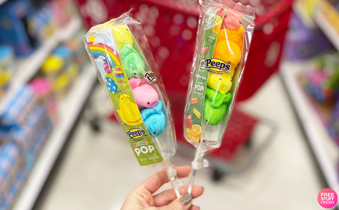 A Person Holding Two Peeps Rainbow Marshmallow Chick Pops at Target