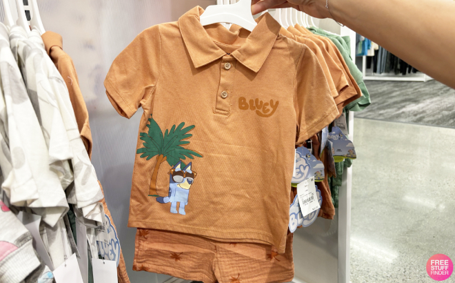 A Person Holding a Bluey Toddler Boys Gauze Polo Top and Shorts Set