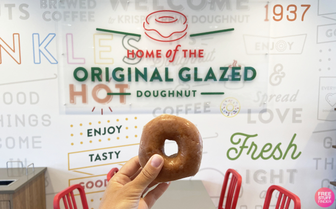 A Person Holding a Krispy Kreme Original Glazed Donut