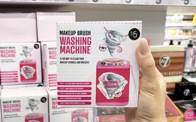 A Person Holding a Makeup Brush Washing Machine