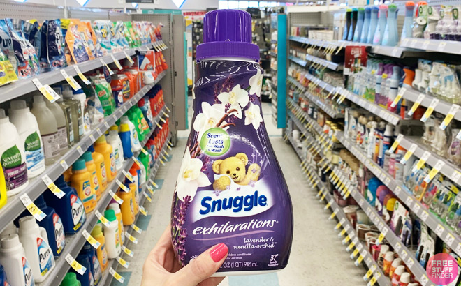 A Person Holding a Snuggle Exhilarations Liquid Fabric Softener