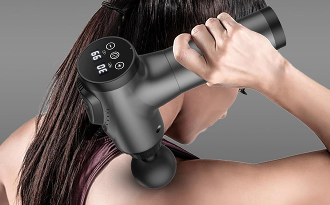 A Person Using Apherma Deep Tissue Massage Gun