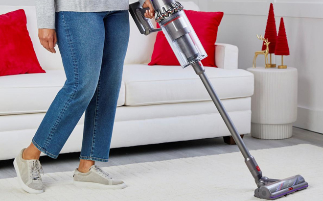 A Person Using Dyson Outsize Plus Cordless Vacuum