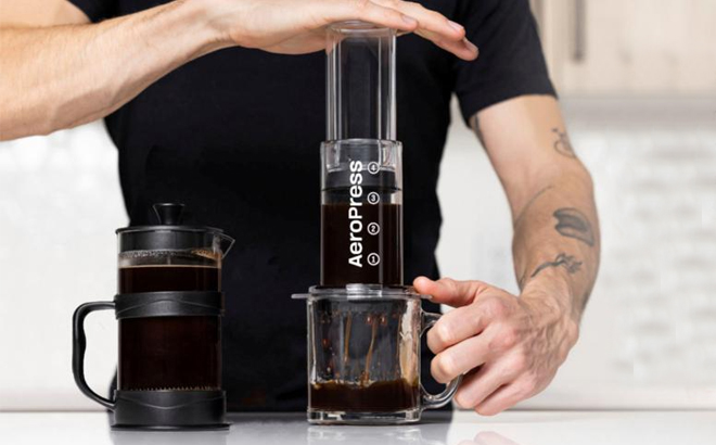 A Person Using the AeroPress Tinted 3 in 1 Brewing Coffee Press A Person Using the AeroPress Tinted 3 in 1 Brewing Coffee Press