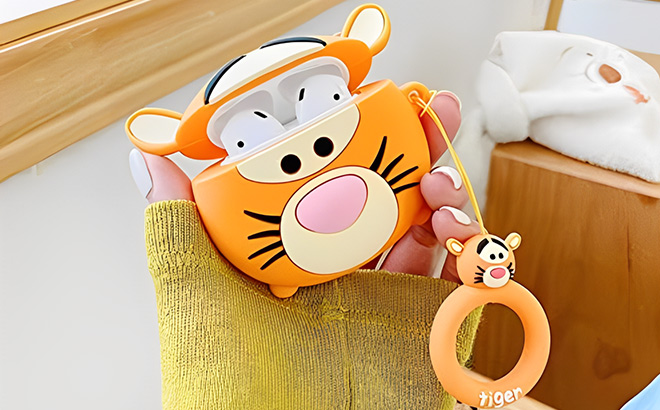 A Person is Holding Cute AirPod Pro Case Cover with Loop Soft Silicone Winnie The Pooh Tigger
