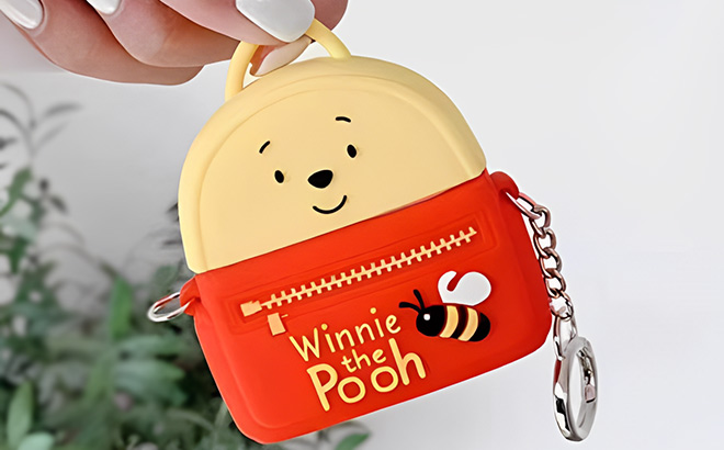 A Person is Holding Cute AirPod Winnie the Pooh Case