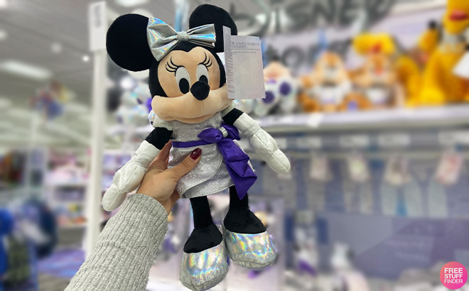 A Person is Holding Disney100 Minnie Mouse Plush