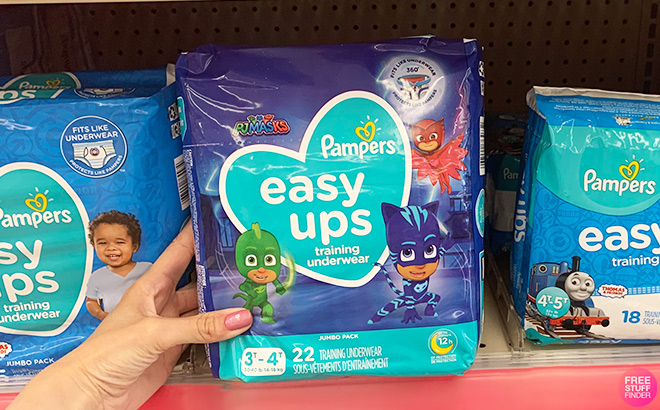 A Person is Holding Pampers Easy Ups Training Underwear 3T 4T