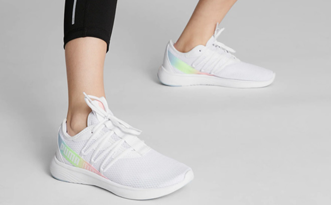A Person is Wearing Puma Womens Star Vital Stripe Running Shoes