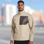 A Person is Wearing Under Armour ColdGear Infrared Shield Softshell Jacket in City Khaki Color