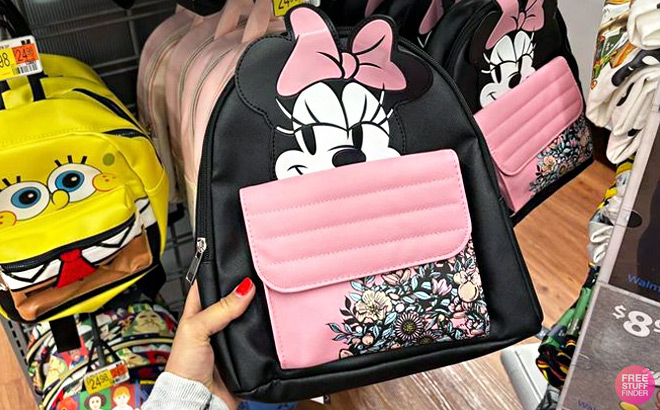 A Prerson Holding Disney Minnie Mouse Graphic Mini Backpack
