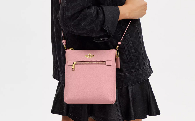 A Woman Wearing Coach Outlet Mini Rowan File Bag