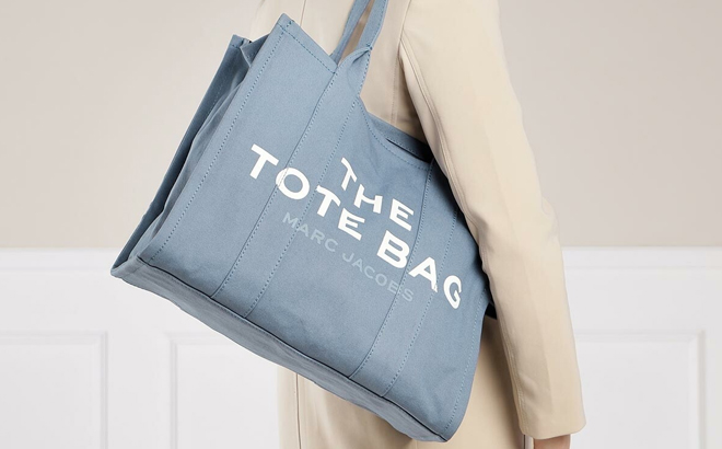A Woman Wearing Marc Jacobs The Large Tote Bag