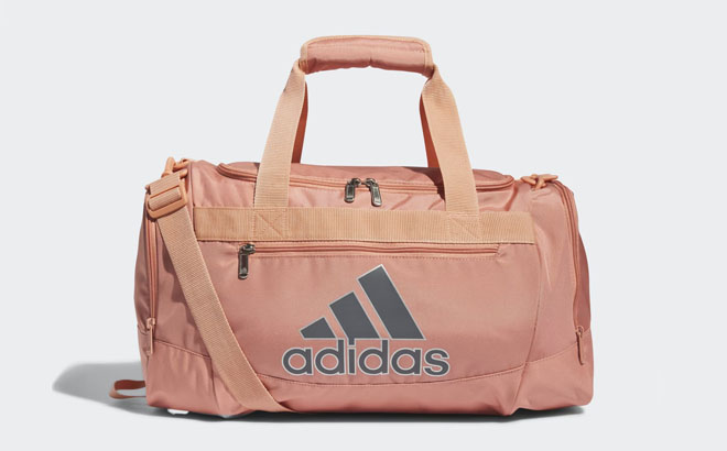 Adidas Defender IV Small Duffel Bag on a Gray Background
