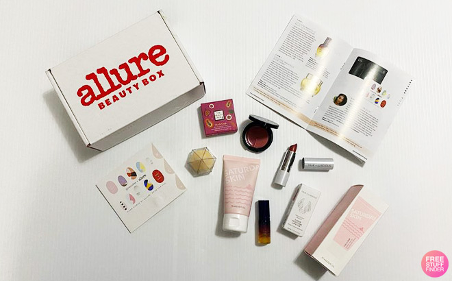 Allure Beauty Box next to Beauty Products and a Magazine on a Table Top