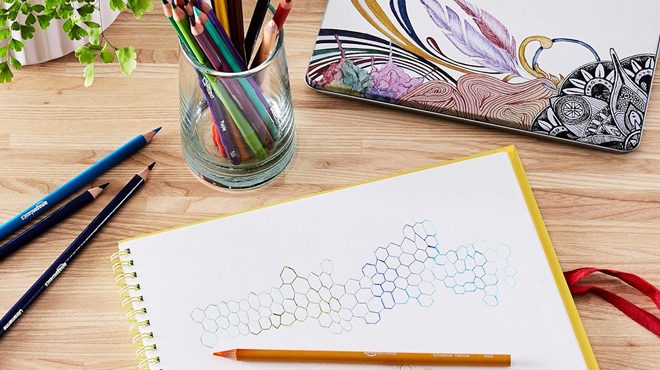 Amazon Basics Premium Colored Pencil and a Drawing Book on a Table