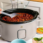 Beautiful by Drew Barrymore 6 Quart Slow Cooker on a Table