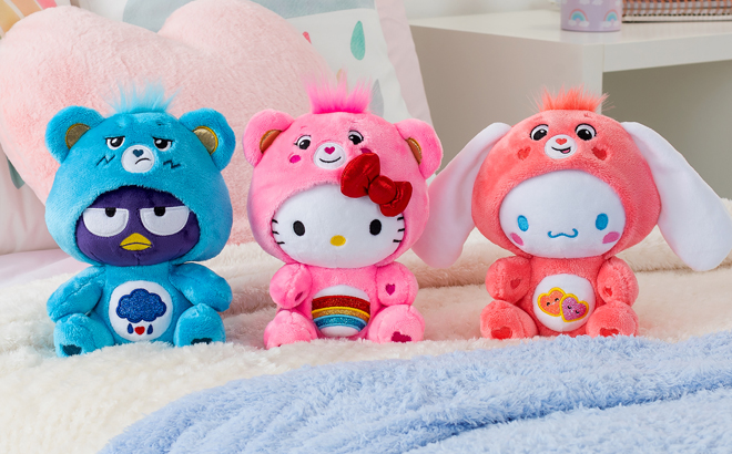 Care Bear x Hello Kitty Plush Toys on a Bed