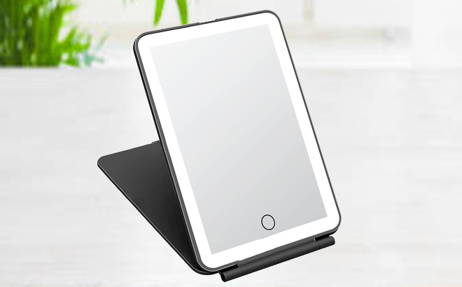 Foldable LED Makeup Mirror in Black Color on a Desk Foldable LED Makeup Mirror in Black Color on a Desk