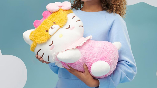 Girl Holding the Hello Kitty and Friends Hello Kitty 18 inch Sleeping Plush