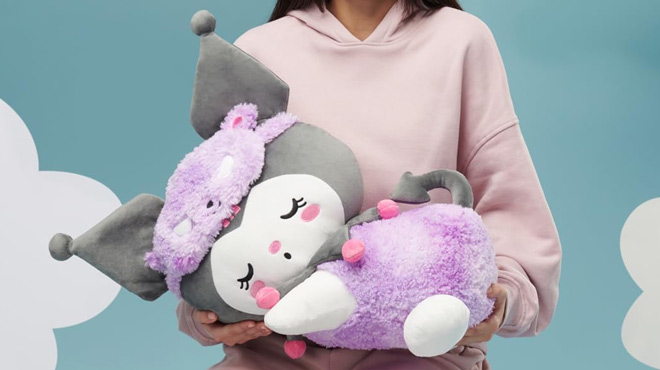 Girl Holding the Hello Kitty and Friends Kuromi 18 inch Sleeping Plush