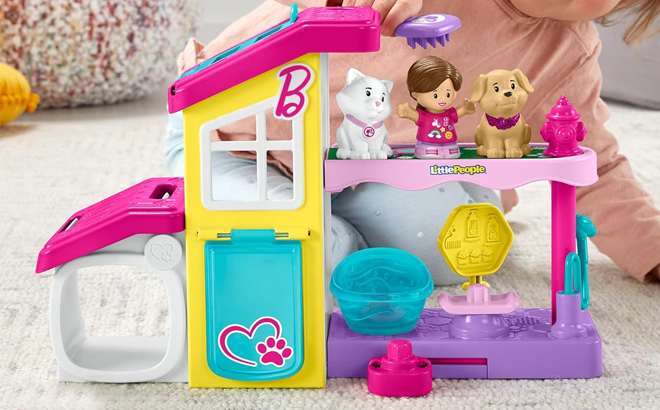 Girl Playing with the Fisher Price Little People Barbie Pet Spa Set