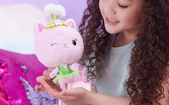 Girl is Holding Spin Master Gabbys Dollhouse Kitty Fairy Purr ific Plush Toy