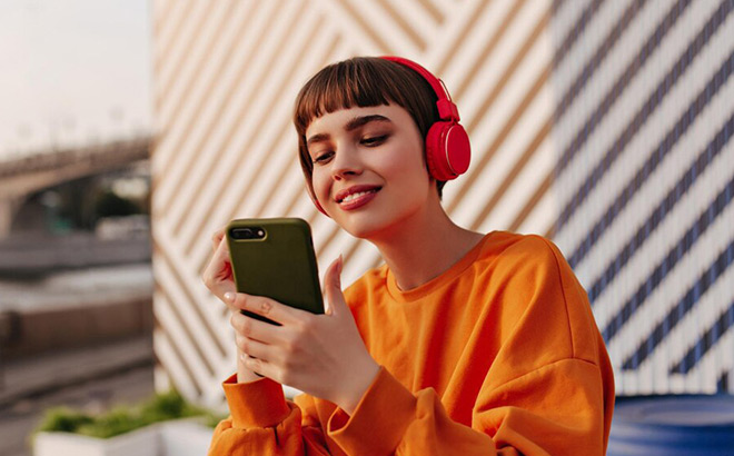 Girl with Headphones Listening to Music