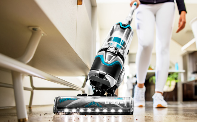 Hand Holding Bissell SurfaceSense Multi Surface Upright Vacuum