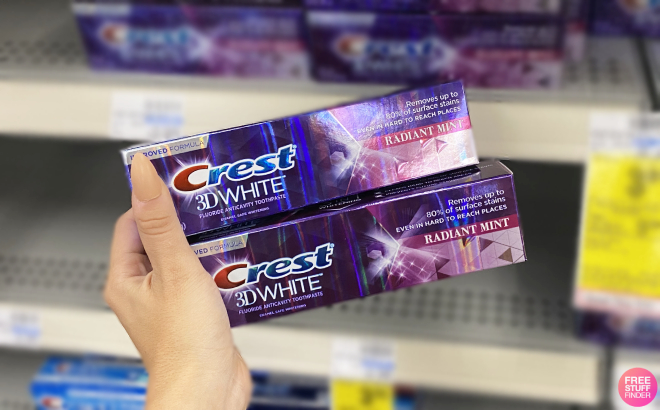 Hand Holding Crest 3D White Toothpaste