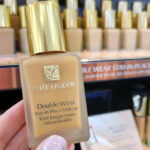 Hand Holding Estee Lauder Double Wear Stay In Place Makeup Foundation