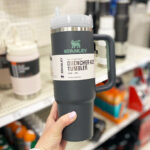 Hand Holding Stanley Quencher Flowstate Tumbler inside a Store