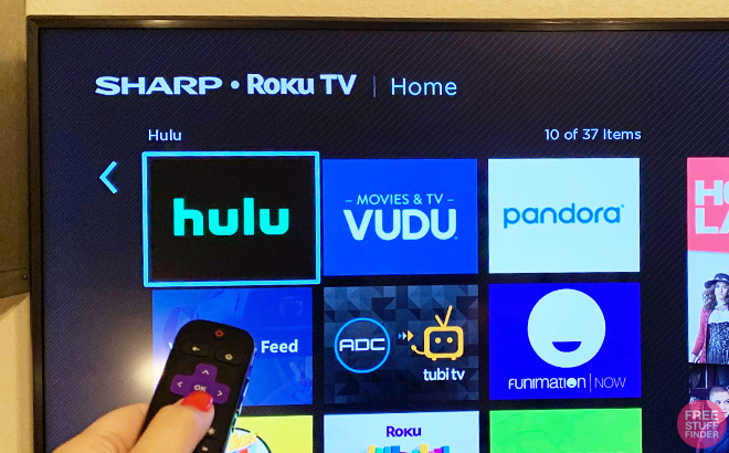 Hand Selecting Hulu with a Remote on Sharp Roku TV