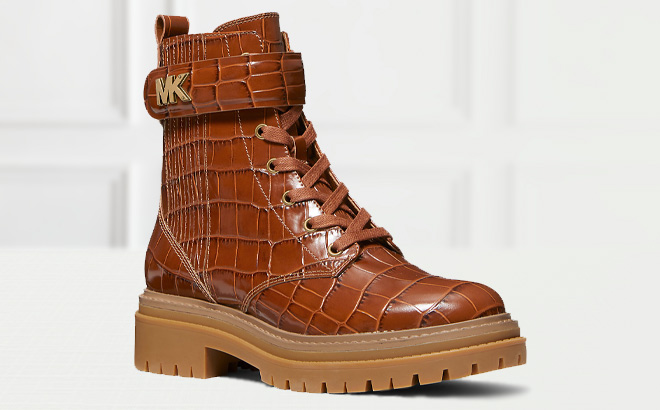 Michael Kors Stark Crocodile Embossed Leather Combat Boot in Chestnut Color on the Table