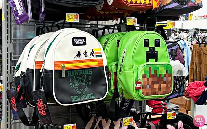 Minecraft Creeper Mini Dome Backpack and Stranger Things Hawkins Mini Backpack on a Shelf