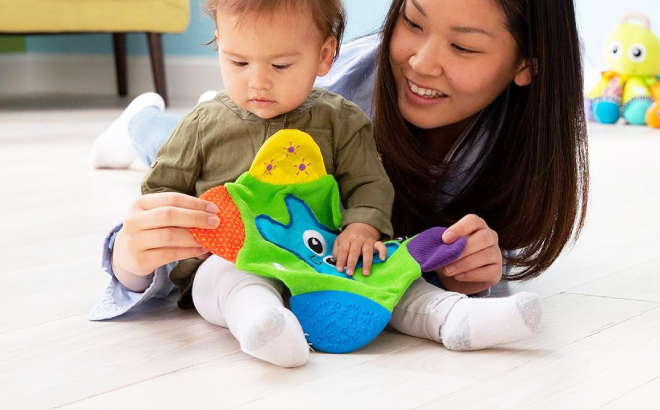Mother and Baby Holding a Lamaze Starfish Teether Blanket