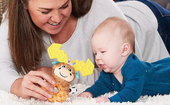 Mother playing with her baby using Lamaze My First Mortimer the Moose Loop Rattle